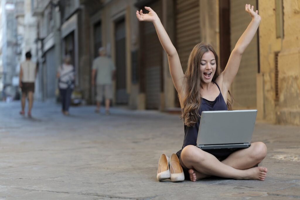 digital nomad in spain with laptop on the street