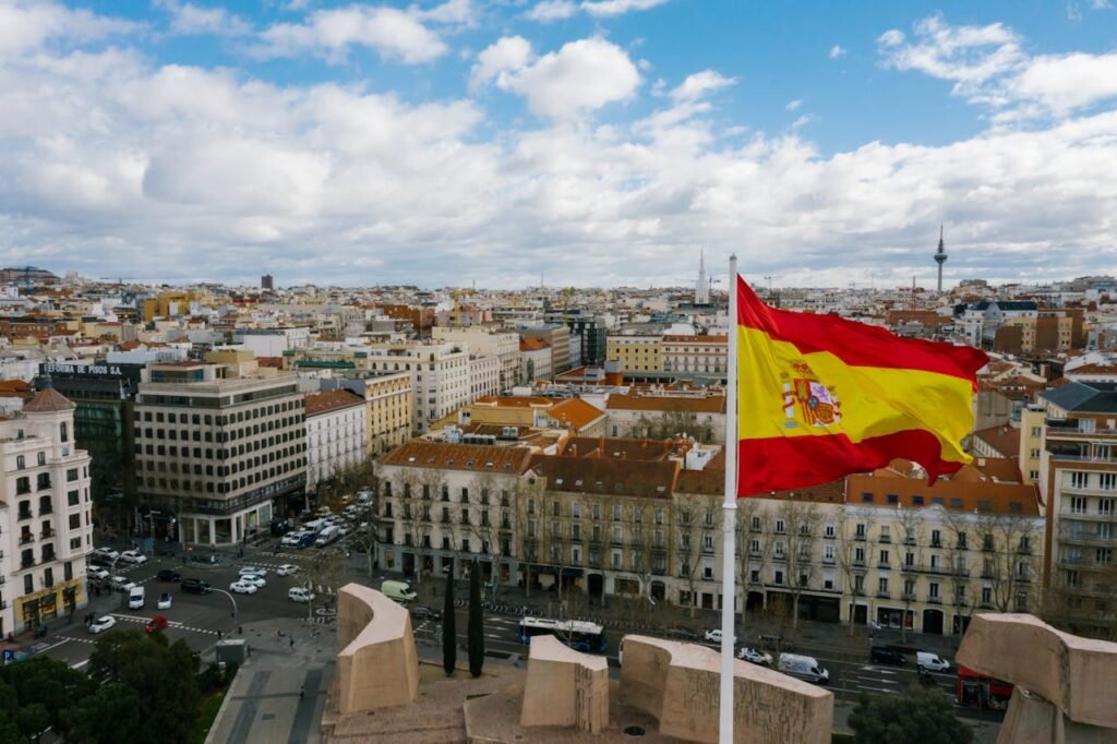 photo of spain city with spanish flag